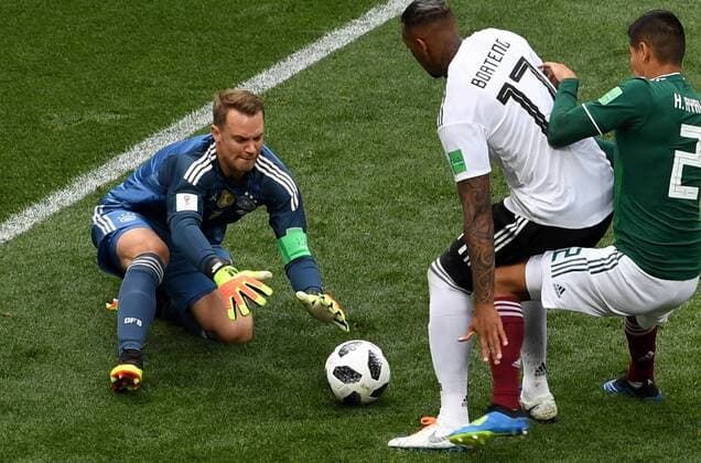 (180617) -- MOSCOW, June 17, 2018 -- Germany s goalkeeper Manuel Neuer (L) defends during a group F match between Germany and Mexico at the 2018 FIFA World Cup WM Weltmeisterschaft Fussball in Moscow, Russia, June 17, 2018. ) (SP)RUSSIA-MOSCOW-2018 WORLD CUP-GROUP F-GERMANY VS MEXICO WangxYuguo 