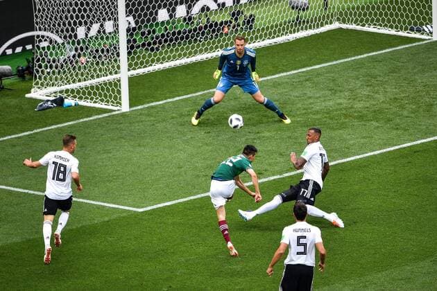 Hirving Lozano of Mexico, center, shoots against Germany in their Group F match during the FIFA World Cup WM Weltmeisterschaft Fussball 2018 in Moscow, Russia, 17 June 2018. Mexico takes lead in first half against Germany  20180617_55541