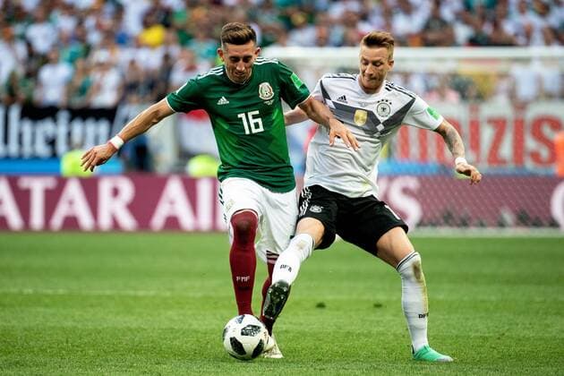 180617 Hector Herrera of Mexico and Marco Reus of Germany during the FIFA World Cup group stage match between Germany and Mexico on June 17, 2018 in Moscow Photo Petter Arvidson BILDBYRAN Code PA 92069  Copyright: PETTERxARVIDSON BB180617PA073