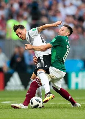 MOSCOW, RUSSIA - JUNE 17, 2018: Germany s Mesut Ozil (L) and Mexico s Carlos Vela fight for the ball in their 2018 FIFA World Cup WM Weltmeisterschaft Fussball Group F football match at Luzhniki Stadium. Denis Tyrin TASS  TS084C87