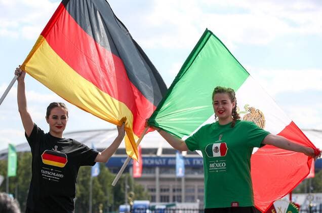 MOSCOW, RUSSIA - JUNE 17, 2018: A German fan and a Mexican fan seen ahead of the 2018 FIFA World Cup WM Weltmeisterschaft Fussball Group F football match between Germany and Mexico at Luzhniki Stadium. Valery Sharifulin TASS  TS084BA2