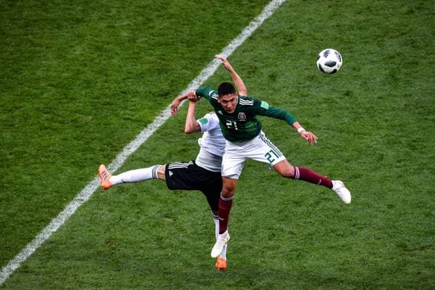 Edson Alvarez of Mexico, right, challenges a player of Germany in their Group F match during the 2018 FIFA World Cup WM Weltmeisterschaft Fussball in Moscow, Russia, 17 June 2018. Mexico won its World Cup opener, hanging on to defeat defending champion Germany 1-0 in Moscow. many  20180618_65250