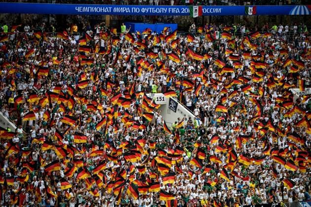 Fans wave flags and shout slogans to show their support for Germany in the Group F match against Mexico during the 2018 FIFA World Cup WM Weltmeisterschaft Fussball in Moscow, Russia, 17 June 2018. Mexico won its World Cup opener, hanging on to defeat defending champion Germany 1-0 in Moscow. many  20180617_56371