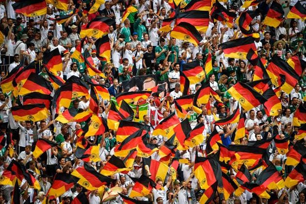 Fans wave flags and shout slogans to show their support for Germany in the Group F match against Mexico during the 2018 FIFA World Cup WM Weltmeisterschaft Fussball in Moscow, Russia, 17 June 2018. Mexico won its World Cup opener, hanging on to defeat defending champion Germany 1-0 in Moscow. many  20180617_30510