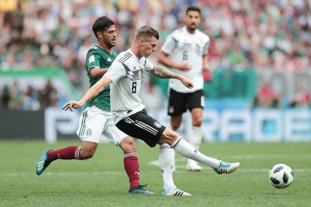 KAZAN, RUSSIA - JUNE 17: midfielder Toni Kroos of Germany and forward Carlos Vela of Mexico during a Group F 2018 FIFA World Cup WM Weltmeisterschaft Fussball soccer match between Germany and Mexico on June 16, 2018, at Kazan Arena in Kazan, Russia. (Photo by Anatoliy Medved Icon Sportswire) SOCCER: JUN 17 FIFA World Cup Group Stage - Germany v Mexico Icon180617012 EDITORIAL USE ONLY