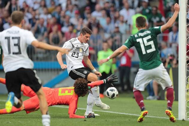 KAZAN, RUSSIA - JUNE 17: goalkeeper Guillermo Ochoa of Mexico and forward Mario Gomez of Germany during a Group F 2018 FIFA World Cup WM Weltmeisterschaft Fussball soccer match between Germany and Mexico on June 16, 2018, at Kazan Arena in Kazan, Russia. (Photo by Anatoliy Medved Icon Sportswire) SOCCER: JUN 17 FIFA World Cup Group Stage - Germany v Mexico Icon180617052 EDITORIAL USE ONLY