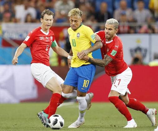Football: Brazil vs Switzerland at World Cup Neymar of Brazil (C) is challenged for the ball by Switzerland s Stephan Lichtsteiner (L) at a World Cup group stage match in the southern Russian city of Rostov-on-Don on June 17, 2018. 