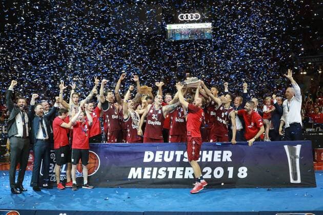 German Champion 2018 Bayern Basketball Team Cup with trophy and award ceremony V l Managing Director Marko Pesic Co Trainer Oliver Kostic Coach Dejan Radonjic Stefan Jovic Vladimir Lucic Nihad Djedovic Alex King Maik Zirbes Anton Gavel with Cup Marvin Ogunsipe Jared Cunningham Braydon Hobbs Managing Director Volker Stix Co Coach Emir Mutapcic Basketball Playoff FC Bayern Munich Basketball Alba Berlin 16 06 2018