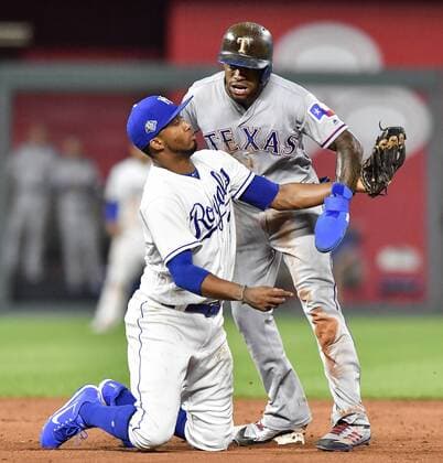 June 18, 2018 - Kansas City, MO, USA - Kansas City Royals shortstop Alcides Escobar tags out Texas Rangers Delino DeShields trying to steal second in the seventh inning during Monday s baseball game on June 18, 2018, at Kauffman Stadium in Kansas City, Mo. Rangers vs Royals - ZUMAm67_ 20180618_zaf_m67_013 Copyright: xJohnxSleezerx