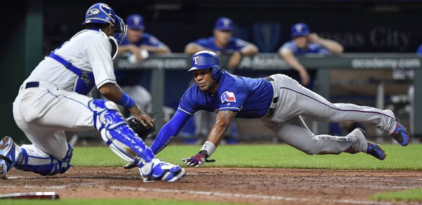 June 19, 2018 - Kansas City, MO, USA - Kansas City Royals catcher Salvador Perez, left, tags out the Texas Rangers Elvis Andrus at the plate on a throw from left fielder Alex Gordon to end the top of the ninth inning at Kauffman Stadium in Kansas City, Mo., on Tuesday, June 19, 2018. Texas at Kansas City - ZUMAm67_ 20180619_zaf_m67_048 Copyright: xJohnxSleezerx