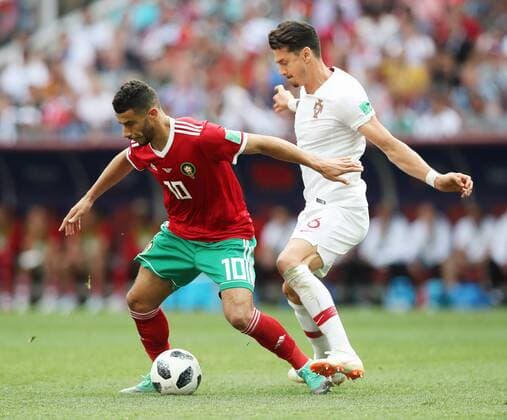 Football - 2018 FIFA World Cup WM Weltmeisterschaft Fussball - Group B: Portugal vs. Morocco Younes Belhanda of Morocco and Jose Fonte of Portugal at the Luzhniki Stadium, Moscow. COLORSPORT IAN MACNICOL 