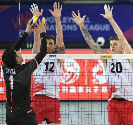 (180624) -- JIANGMEN, June 24, 2018 -- Gavin Schmitt (C) and Arthur Szwarc (R) of Canada block the ball during a match against Japan at the FIVB Volleyball Nations League 2018 men s tournament in Jiangmen, south China s Guangdong Province, June 24, 2018. Canada won 3-0. ) (SP)CHINA-JIANGMEN-VOLLEYBALL-FIVB NATIONS LEAGUE-MEN (CN) DengxHua 