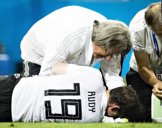 Sochi 23 06 2018 Team doctor Dr Hans Wilhelm Müller Wohlfahrt Germany treats the bleeding Sebastian Rudy Germany Germany Sweden Fisht Stadium Olympic Stadium