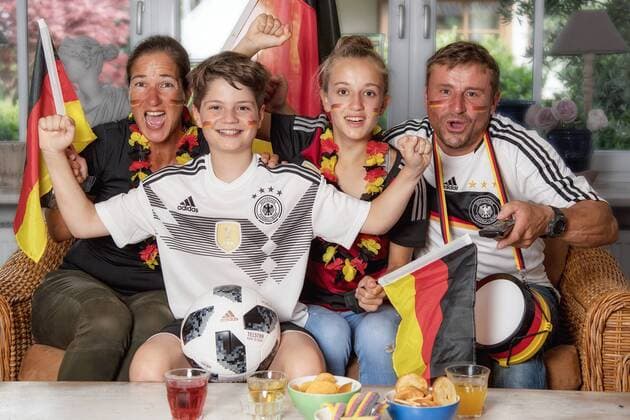 Soccer Family Evi GROIER Benedikt EWALD Hanna GROIER and Alex GROIER on 09 06 2018 during a shoot Soccer World Cup in front of the TV in the living room Traunstein Germany. Model Released. Symbolfoto. Model Released. Symbolfoto