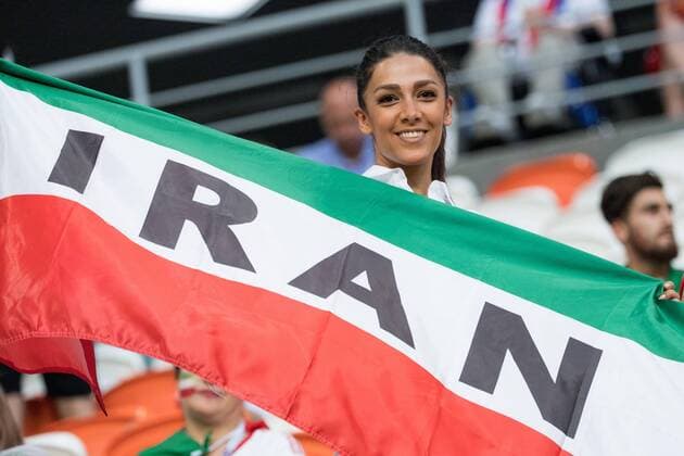 A female Iranian fan with flag Woman Half figure Half figure Fan Fans Spectator Supporter Iran IRN Portugal POR 1 1 Preliminary Group B match 35 on 25 06 2018 in Saransk Football World Cup 2018 in Russia from 14 06 15 07 2018 Â