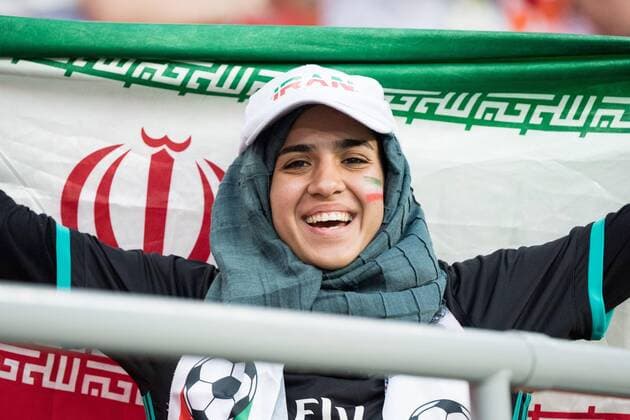 A female Iranian fan with flag Half-length portrait Woman Fan Fans Spectator Supporters Iran IRN Portugal POR 1 1 Preliminary Group B match 35 on 25 06 2018 in Saransk Football World Cup 2018 in Russia from 14 06 15 07 2018 Â