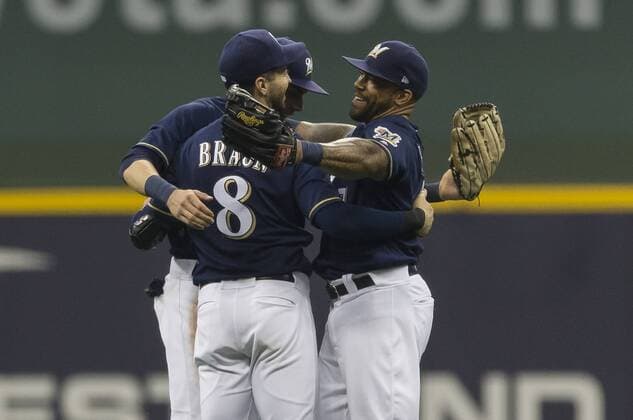 June 26, 2018: Milwaukee Brewers outfielders Ryan Braun 8, Christian Yelich 22, and Eric Thames 7 celebrate a 5-1 win during the Major League Baseball game between the Milwaukee Brewers and the Kansas City Royals at Miller Park in Milwaukee, WI. CSM MLB Baseball Herren USA 2018 Royals vs Brewers JUN 26 - ZUMAc04_ 20180626_zaf_c04_055 Copyright: xJohnxFisherx