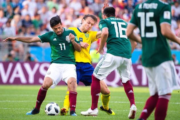 180627 Carlos Vela and Hector Herrera of Mexico against Albin Ekdal of Sweden during the FIFA World Cup group stage match between Mexico and Sweden on June 27, 2018 in Ekaterinburg Photo Joel Marklund BILDBYR N Code JM 87737  Copyright: JOELxMARKLUND BB180627JM052