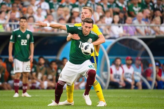 180627 Hector Herrera of Mexico and Sebastian Larsson of Sweden during the FIFA World Cup group stage match between Mexico and Sweden on June 27, 2018 in Ekaterinburg Photo Petter Arvidson BILDBYR N Code PA 87737  Copyright: PETTERxARVIDSON BB180627PA080