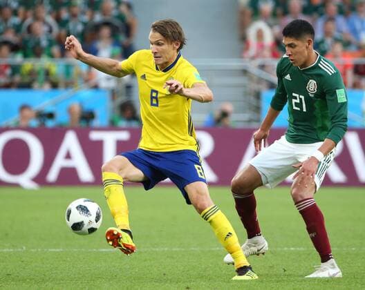 (180627) -- YEKATERINBURG, June 27, 2018 -- Edson Alvarez (R) of Mexico vies with Albin Ekdal of Sweden during the 2018 FIFA World Cup WM Weltmeisterschaft Fussball Group F match between Mexico and Sweden in Yekaterinburg, Russia, June 27, 2018. ) (SP)RUSSIA-YEKATERINBURG-2018 WORLD CUP-GROUP F-MEXICO VS SWEDEN LixMing 