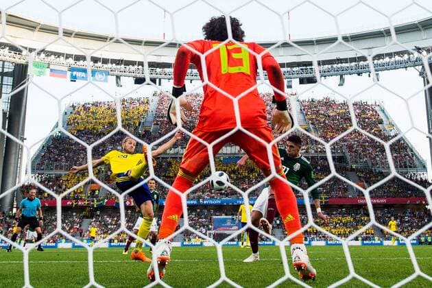 180627 Ola Toivonen of Sweden scores 0 3 behind goalkeeper Guillermo Ochoa or Mexico during the FIFA World Cup group stage match between Mexico and Sweden on June 27, 2018 in Ekaterinburg Photo Petter Arvidson BILDBYR N Code PA 87737  Copyright: PETTERxARVIDSON BB180627PA157