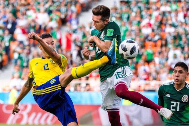 180627 Mikael Lustig of Sweden and Hector Herrera of Mexico during the FIFA World Cup group stage match between Mexico and Sweden on June 27, 2018 in Ekaterinburg Photo Joel Marklund BILDBYR N Code JM 87737  Copyright: JOELxMARKLUND BB180627JM144