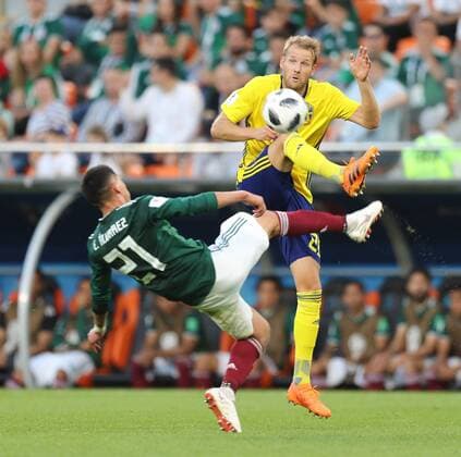 (180627) -- YEKATERINBURG, June 27, 2018 -- Edson Alvarez (L) of Mexico vies with Ola Toivonen of Sweden during the 2018 FIFA World Cup WM Weltmeisterschaft Fussball Group F match between Mexico and Sweden in Yekaterinburg, Russia, June 27, 2018. ) (SP)RUSSIA-YEKATERINBURG-2018 WORLD CUP-GROUP F-MEXICO VS SWEDEN LuxJinbo 
