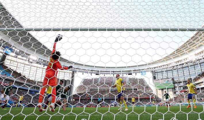 (180627) -- YEKATERINBURG, June 27, 2018 -- Goalkeeper Guillermo Ochoa (L) of Mexico defends during the 2018 FIFA World Cup WM Weltmeisterschaft Fussball Group F match between Mexico and Sweden in Yekaterinburg, Russia, June 27, 2018. Sweden won 3-0. Mexico and Sweden advanced to the round of 16. ) (SP)RUSSIA-YEKATERINBURG-2018 WORLD CUP-GROUP F-MEXICO VS SWEDEN LixMing 