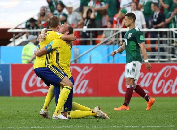 (180627) -- YEKATERINBURG, June 27, 2018 -- Ludwig Augustinsson (L) and Andreas Granqvist (C) of Sweden celebrate victory after the 2018 FIFA World Cup WM Weltmeisterschaft Fussball Group F match between Mexico and Sweden in Yekaterinburg, Russia, June 27, 2018. Sweden won 3-0. Mexico and Sweden advanced to the round of 16. ) (SP)RUSSIA-YEKATERINBURG-2018 WORLD CUP-GROUP F-MEXICO VS SWEDEN LixMing 