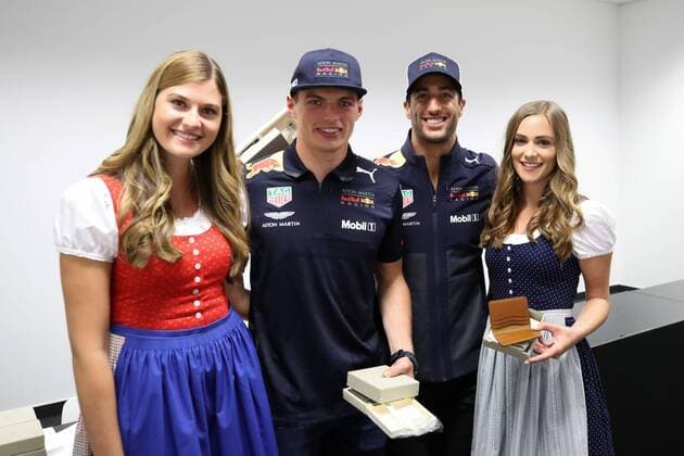 FORMULA 1 - GP of Austria 2018 SPIELBERG,AUSTRIA,29.JUN.18 - MOTORSPORTS, FORMULA 1 - Grand Prix of Austria, Red Bull Ring, free practice. Image shows Max Verstappen (NED Red Bull Racing) and Daniel Ricciardo (AUS Red Bull Racing) with girls. GEPAxpictures xChristianxWalgram