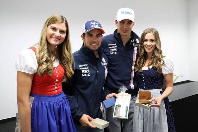 FORMULA 1 - GP of Austria 2018 SPIELBERG,AUSTRIA,29.JUN.18 - MOTORSPORTS, FORMULA 1 - Grand Prix of Austria, Red Bull Ring, free practice. Image shows Sergio Perez (MEX Force India) and Esteban Ocon (FRA Force India) with girls. GEPAxpictures xChristianxWalgram