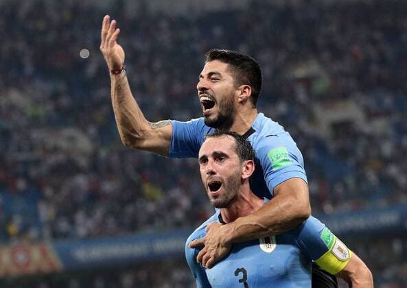 SOCHI, RUSSIA â€“ JUNE 30, 2018: Uruguay s Diego Godin and Luis Suarez celebrate winning their 2018 FIFA World Cup WM Weltmeisterschaft Fussball Round of 16 football match against Portugal at Fisht Stadium. Team Uruguay won the game 2:1. Sergei Bobylev TASS  TS08749D