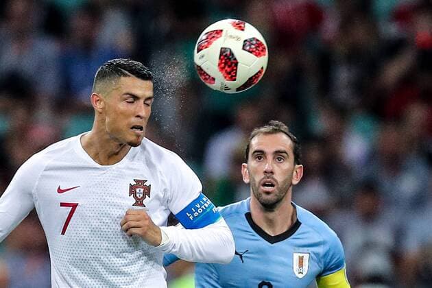 SOCHI, RUSSIA â€“ JUNE 30, 2018: Portugal s Cristiano Ronaldo (L) and Uruguay s Nahitan Nandez in their 2018 FIFA World Cup WM Weltmeisterschaft Fussball Round of 16 football at Fisht Stadium. Team Uruguay won the game 2:1. Sergei Bobylev TASS  TS0874F9
