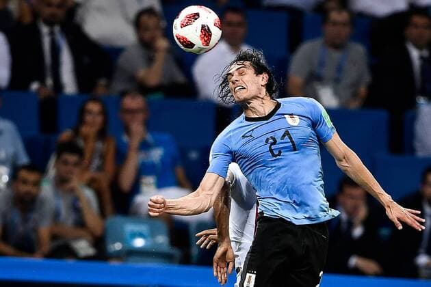 Edinson Cavani of Uruguay heads the ball against Portugal in the round of 16 match between Uruguay and Portugal during the 2018 FIFA World Cup WM Weltmeisterschaft Fussball in Sochi, Russia, 30 June 2018. Uruguay conceded their first Russia World Cup goal in the last 16 clash against Portugal but Edinson Cavani s double sent them through to the quarterfinals here on Saturday at the Fisht Olympic Stadium. They will next face France, who had earlier knocked out Lionel Messi s Argentina 4-3. Forward of Paris Saint-Germain, Cavani scored once at each half of the match, before he was injured and left the pitch supported by Portugal captain Cristiano Ronaldo. Portugal, after their impressive performances in four matches, will go home, and Real Madrid forward Ronaldo s fourth World Cup journey finished earlier than expected. Great efforts were mounted by the European Champions, who, in the 55th minute, for the first time at this World Cup struck a ball into the tightly-guarded Uruguay net. Cavani scores twice to send Uruguay to the last eight  20180701_42035