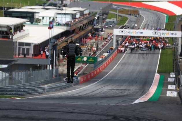 1st July 2018, Red Bull Ring, Spielberg, Austria; Austrian Formula One Grand Prix, Sunday race day; A pilot in a Jet powered flight suit hovers at the end of the straight  ActionPlus12043252 Octane