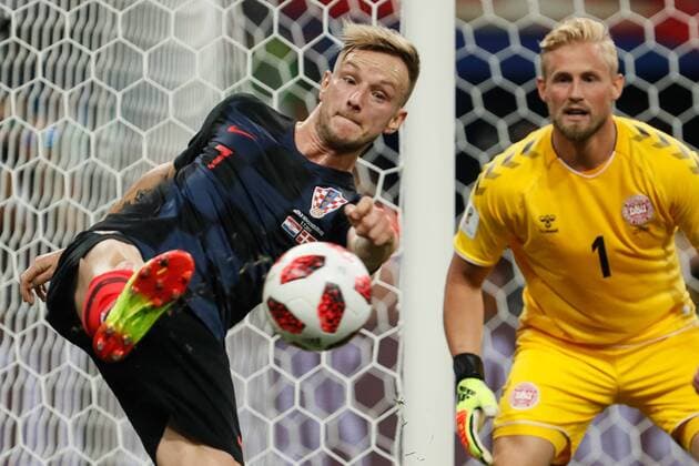 July 1, 2018 - Nizhny Novgorod, Russia - Ivan Rakitic (L) of Croatia national team Nationalteam and Kasper Schmeichel of Denmark national team in action during the 2018 FIFA World Cup WM Weltmeisterschaft Fussball Russia Round of 16 match between Croatia and Denmark on July 1, 2018 at Nizhny Novgorod Stadium in Nizhny Novgorod, Russia. Croatia v Denmark: Round of 16 - 2018 FIFA World Cup  - ZUMAn230 20180701_zaa_n230_343 Copyright: xMikexKireevx