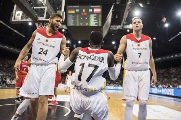 Feature Maximilian KLEBER l GER and Johannes VOIGTMANN r GER help Dennis SCHROEDER Schröder GER on his feet Basketball World Cup qualification Germany GER Austria AUT 85 63 at 29 06 2018 in Braunschweig Germany