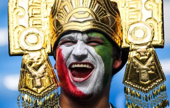 SAMARA, RUSSIA - JULY 2, 2018: A Mexican football fan has painted his face in national colours ahead of his team s 2018 FIFA World Cup WM Weltmeisterschaft Fussball Round of 16 match against Brazil at Samara Arena Stadium. Sergei Bobylev TASS  TS08792A
