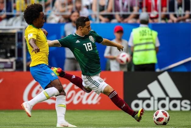 SAMARA, RUSSIA - JULY 2, 2018: Brazilâ€™s Willian (L) and Mexicoâ€™s Andres Guardado in their 2018 FIFA World Cup WM Weltmeisterschaft Fussball Round of 16 match at Samara Arena Stadium. Sergei Bobylev TASS  TS08793B