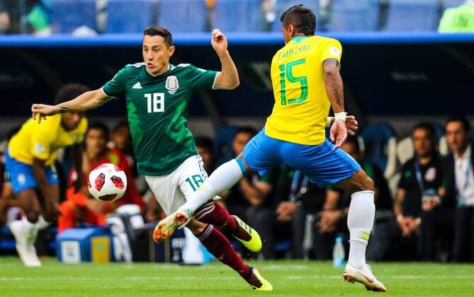 SAMARA, RUSSIA - JULY 2, 2018: Mexicoâ€™s Andres Guardado and Brazilâ€™s Paulinho (L-R front) in their 2018 FIFA World Cup WM Weltmeisterschaft Fussball Round of 16 match at Samara Arena Stadium. Sergei Bobylev TASS  TS08794B