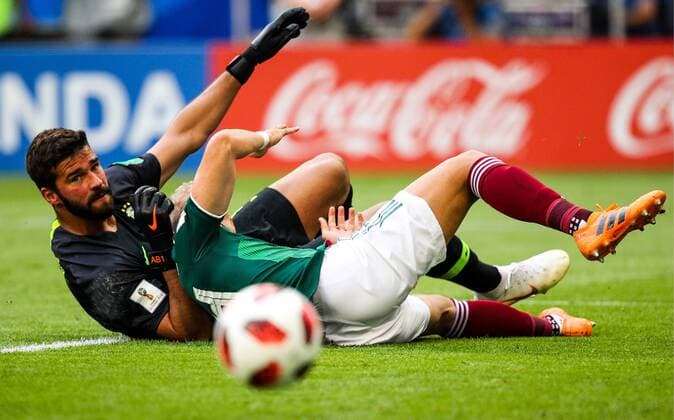 SAMARA, RUSSIA - JULY 2, 2018: Brazilâ€™s goalkeeper Alisson (L) and Mexicoâ€™s Javier Hernandez in their 2018 FIFA World Cup WM Weltmeisterschaft Fussball Round of 16 match at Samara Arena Stadium. Sergei Bobylev TASS  TS08794C