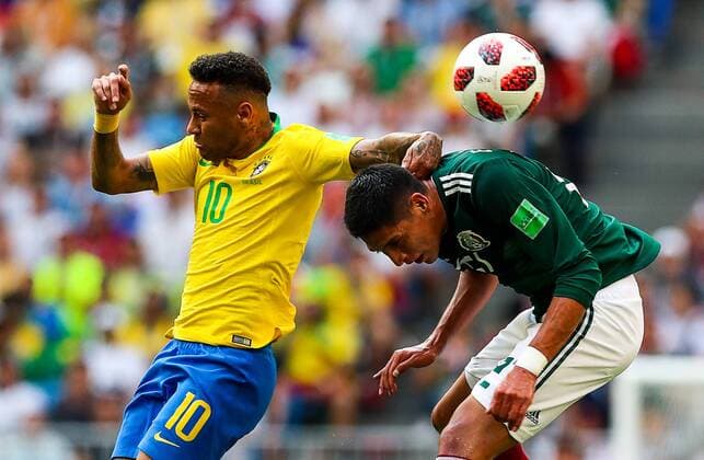 SAMARA, RUSSIA - JULY 2, 2018: Brazilâ€™s Neymar (L) and Mexicoâ€™s Edson Alvarez in their 2018 FIFA World Cup WM Weltmeisterschaft Fussball Round of 16 match at Samara Arena Stadium. Sergei Savostyanov TASS  TS087947