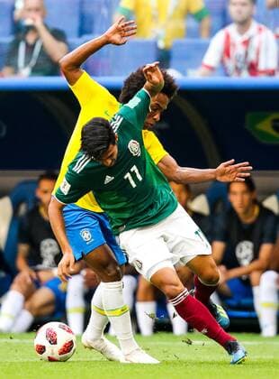 SAMARA, RUSSIA - JULY 2, 2018: Mexicoâ€™s Carlos Vela (front) and Brazilâ€™s Willian in their 2018 FIFA World Cup WM Weltmeisterschaft Fussball Round of 16 match at Samara Arena Stadium. Sergei Bobylev TASS  TS087954