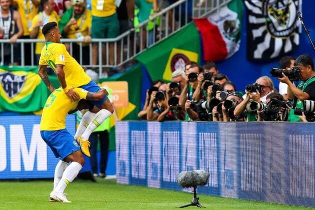 SAMARA, RUSSIA - JULY 2, 2018: Brazilâ€™s Paulinho (standing) and Neymar celebrate scoring against Mexico in their 2018 FIFA World Cup WM Weltmeisterschaft Fussball Round of 16 match at Samara Arena Stadium. Sergei Savostyanov TASS  TS08799A