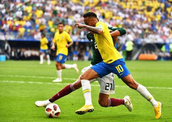 Neymar of Brazil, right, challenges Edson Alvarez of Mexico in their Round of 16 match during the 2018 FIFA World Cup WM Weltmeisterschaft Fussball in Samara, Russia, 2 July 2018. Brazil has roared into the World Cup quarter-finals with a 2-0 victory over Mexico as Neymar shone with a goal and an assist that dumped the central Americans out at the last 16 stage for the seventh straight occasion. The PSG forward slid home in the second half and then teed up Roberto Firmino late on as the five-times champions beat an otherwise stubborn Mexico, whose World Cup began with such promise with a victory over champions Germany, but ended in familiar fashion in the first knockout round. Brazil beats Mexico 2-0 to progress as Neymar shows his brilliant best and frustrating worst  20180703_66227