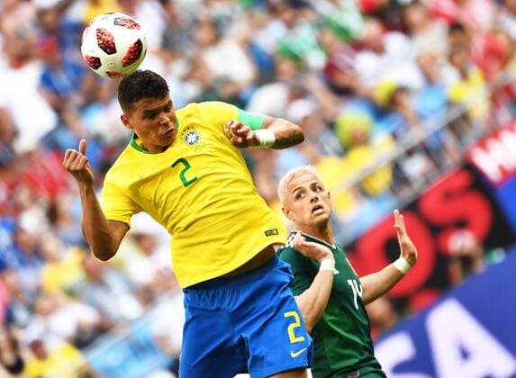 Thiago Silva of Brazil, left, challenges Javier Hernandez of Mexico in their Round of 16 match during the 2018 FIFA World Cup WM Weltmeisterschaft Fussball in Samara, Russia, 2 July 2018. Brazil has roared into the World Cup quarter-finals with a 2-0 victory over Mexico as Neymar shone with a goal and an assist that dumped the central Americans out at the last 16 stage for the seventh straight occasion. The PSG forward slid home in the second half and then teed up Roberto Firmino late on as the five-times champions beat an otherwise stubborn Mexico, whose World Cup began with such promise with a victory over champions Germany, but ended in familiar fashion in the first knockout round. Brazil beats Mexico 2-0 to progress as Neymar shows his brilliant best and frustrating worst  20180703_66229