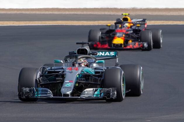 6th July 2018, Silverstone Circuit, Silverstone, England; British Formula One Grand Prix, Friday free practice; Lewis Hamilton in his Mercedes AMG Petronas Motorsport Mercedes F1 W09 ahead of Max Verstappen in his Aston Martin Red Bull Racing Red Bull Racing TAG Heuer RB14  ActionPlus12044448 TimxWilliams