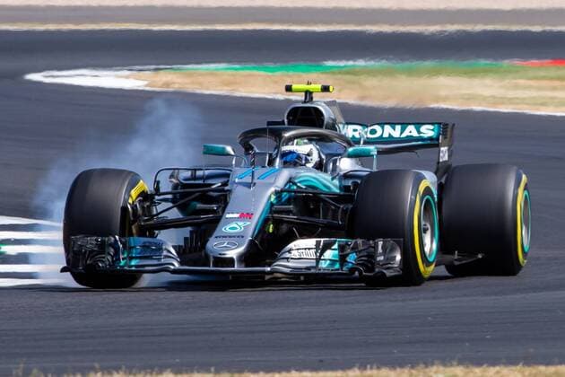 6th July 2018, Silverstone Circuit, Silverstone, England; British Formula One Grand Prix, Friday free practice; Valtteri Bottas locks a front wheel on his Mercedes AMG Petronas Motorsport Mercedes F1 W09  ActionPlus12044453 TimxWilliams