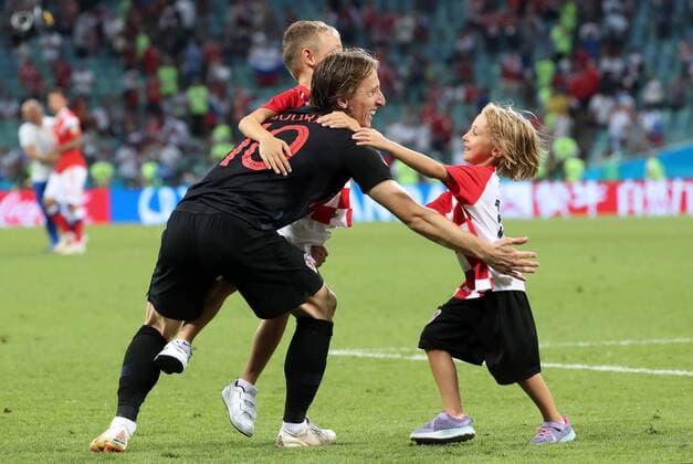 SOCHI, RUSSIA - JULY 7, 2018: Croatia s Luka Modric with his children celebrates winning the 2018 FIFA World Cup WM Weltmeisterschaft Fussball Quarterfinal match against Russia at Fisht Stadium. Croatia won the game on penalties 4-3. Alexander Demianchuk TASS  TS088A3E