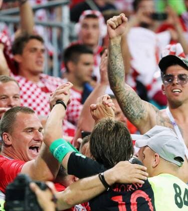 SOCHI, RUSSIA - JULY 7, 2018: Croatia s Luka Modric (front) with fans celebrates winning the 2018 FIFA World Cup WM Weltmeisterschaft Fussball Quarterfinal match against Russia at Fisht Stadium. Croatia won the game on penalties 4-3. Alexander Demianchuk TASS  TS088A3D